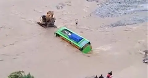 Bus stranded in flooded Nawa Khola on Tamor corridor, all 30 passengers rescued safely